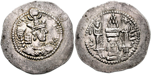 Silver coin of Yazdegerd II with a fire altar and two attendants. Sassanid king. Yazdgard II (438-457 AD). AR Drachm (29mm, 3.68 gm, 3h). Crowned bust right / "Fire" in Pahlavi to left, 'nwky' in Pahlavi to right, fire altar with attendants, holding staves, and ribbon, "rast" in Pahlavi on central column. Göbl I/1; Alram 869. EF, light die rust. Ex Bellaria Collection. This file is licensed under the Creative Commons Attribution-Share Alike 3.0 Unported license. Attribution: Classical Numismatic Group, Inc. http://www.cngcoins.com